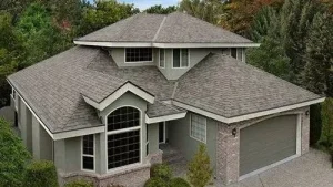 An aerial view of a large house with a gray roof